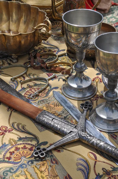 Swords and stemware — Stock Photo, Image