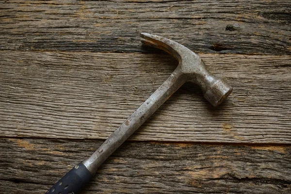 Hammer on rustic hardwood floor — Stock Photo, Image