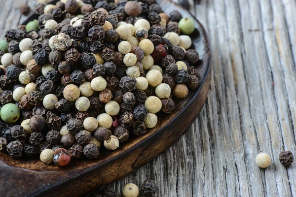 Peppercorn on a wooden Spoon — Stock Photo, Image