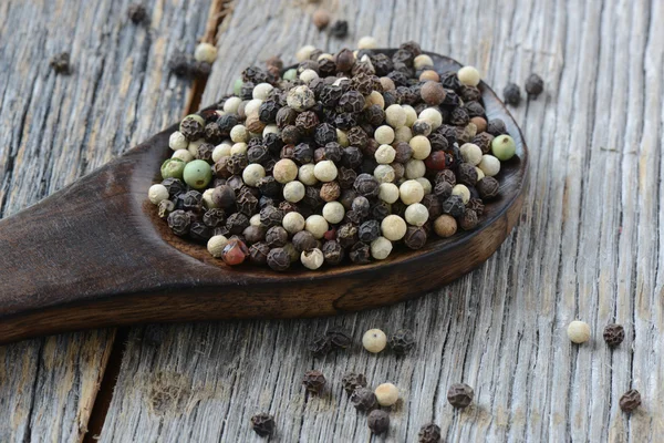 Peppercorn on a wooden Spoon — Stock Photo, Image