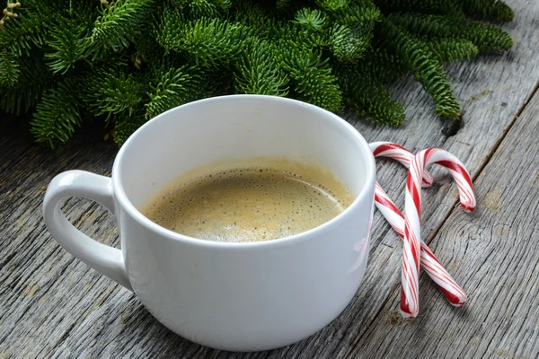 Coffee and Candy Cane for the Holidays with Christmas Pine Branc — Stock Photo, Image