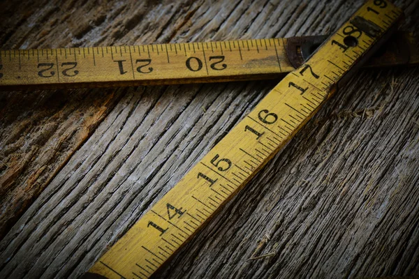 ( 영어 ) Old Tape Measure on Rustic Wood Background — 스톡 사진