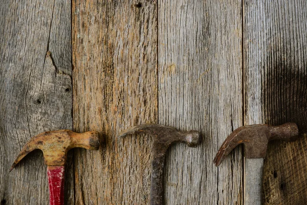 Old Hammers on Rustic Wood Background — Stock Photo, Image