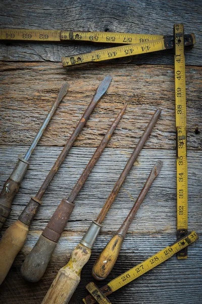 Rustic Screwdrivers and Tape Measure on Wood Background — Stock Photo, Image