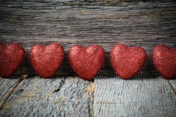 Hearts on Vintage Wood Background for Valentine's Day — Stock Photo, Image