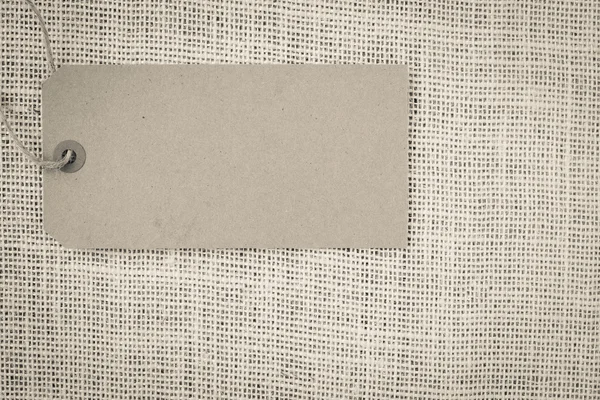 Blank Paper Tag on Burlap Background — Stock Photo, Image