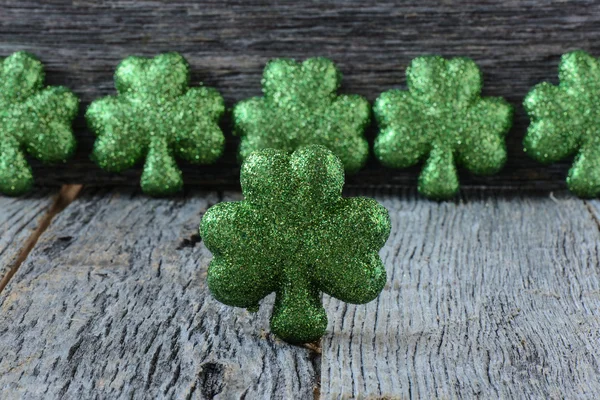 Clovers on wooden background — Stock Photo, Image