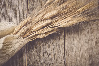 Wheat Ears over Rustic Wood clipart