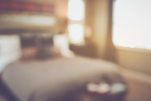 Blurred Bedroom with Bed and Nightstand — Stock Photo, Image