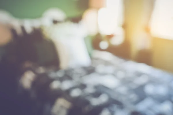 Blurred Bedroom with Bed and Nightstand — Stock Photo, Image