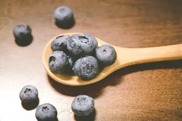Fresh Blueberries on spoon — Stock Photo, Image