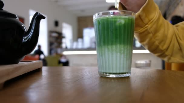 Man Hand Yellow Clothes Stir Japanese Green Ice Tea Matcha — Stock Video