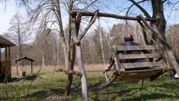 Aged Man Wooden Swing Forest Place Rest — Stock Video