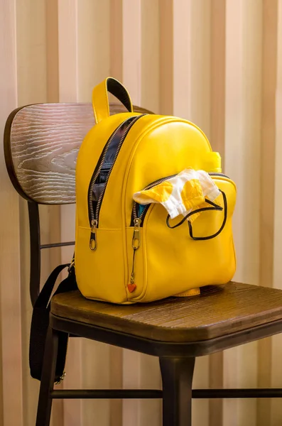 Yellow Urban Backpack White Protective Mask His Pocket Stands Wooden — Stock Photo, Image