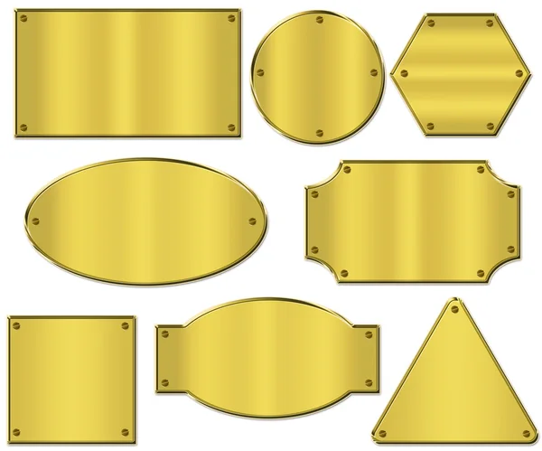 Goldene Tabletten in verschiedenen Formen auf weißem Hintergrund — Stockfoto