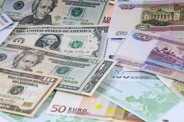 Hintergrund Rubel, Dollar und Euro. Stockbild