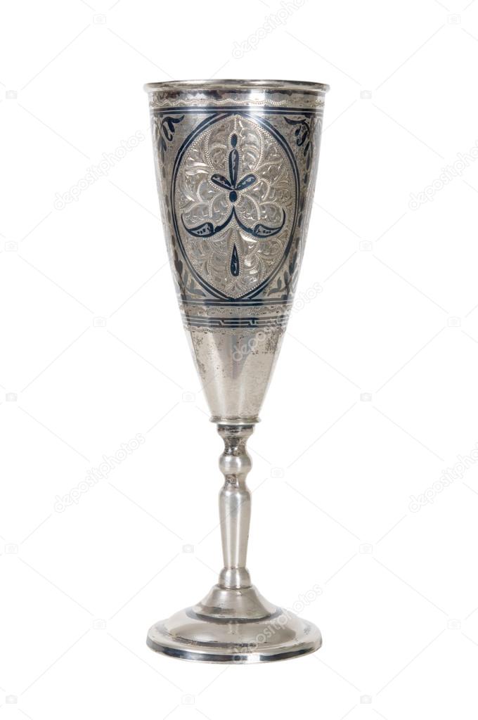 Silver wineglass on white
