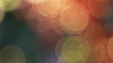 Yumuşak bokeh ışıkları çerçeveyi kırmızı ve altın tonlarla doldurur. Keskin detaylar olmadan tamamen bulanık bir arkaplan yaratır..