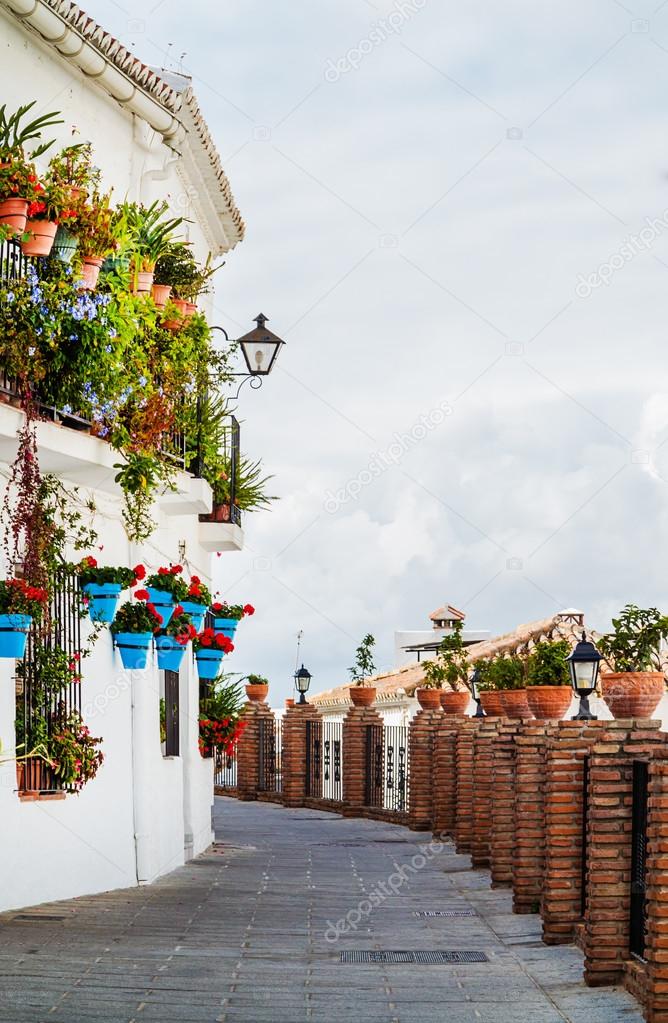 Blue Pots of Mijas in an alleyway, Andalucia, near Malaga, Spain