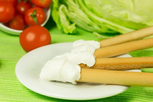 Breadsticks and cream cheese — Stock Photo, Image