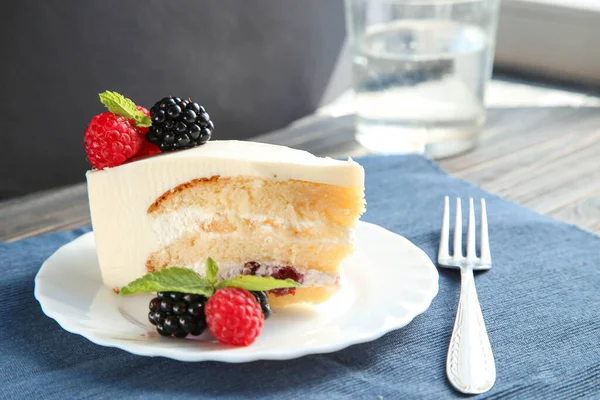 A piece of delicious cake with berries and mint — Stock Photo, Image
