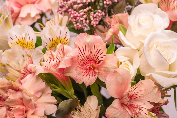 Bouquet of Soft Pink Flowers in Pink Wrapping Paper Stock Photo