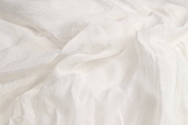 Yumuşak beyaz ipek kumaş arka plan. Kumaş dokusu. 