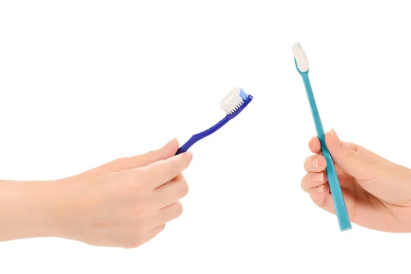 女人手里拿着牙刷 手握牙膏 用白色背景隔开 — 图库照片