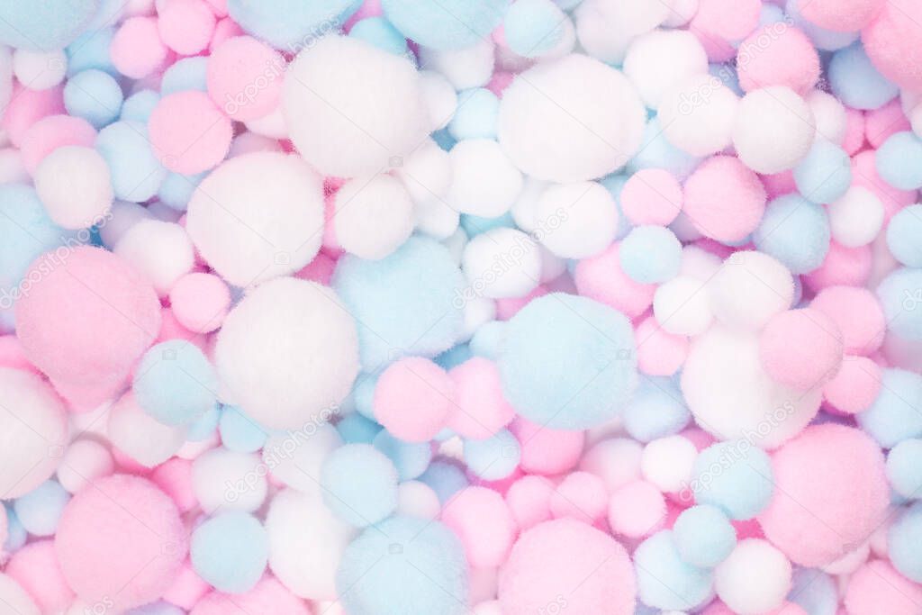 White, pink and blue soft pompons background. 