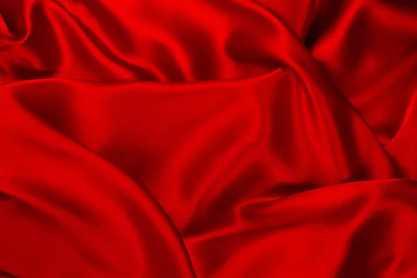 红色和橙色丝绸或缎子的奢侈面料可以用作抽象的背景 顶部视图 — 图库照片