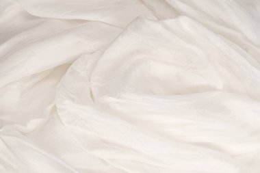 Yumuşak beyaz ipek kumaş arka plan. Kumaş dokusu. 