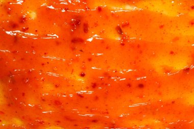 Arkaplan olarak portakal sosu sıçrar. 