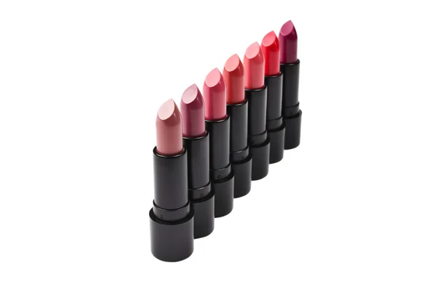 Veel Verschillende Lipsticks Verschillende Kleuren Lila Achtergrond Geïsoleerd Witte Achtergrond — Stockfoto