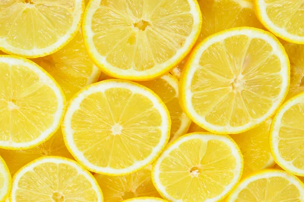 Bir dilim taze, sulu sarı limon. Doku arkaplanı, desen.