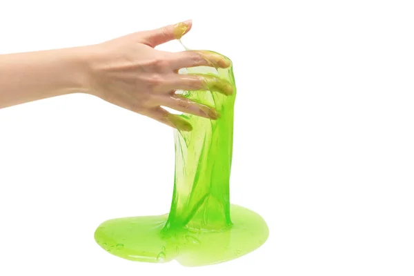 女性手中的绿色黏液玩具 白色背景隔离 — 图库照片