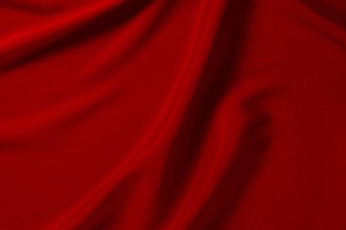 Kırmızı ipek ya da saten lüks kumaş dokusu soyut bir arka plan olarak kullanılabilir. Üst görünüm.