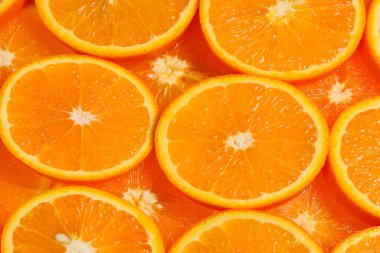 Arkaplan olarak portakal dilimleri, üst görünüm. 