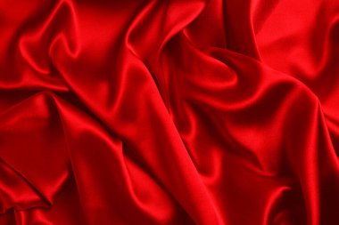 Kırmızı ipek ya da saten lüks kumaş dokusu soyut bir arka plan olarak kullanılabilir. Üst görünüm.