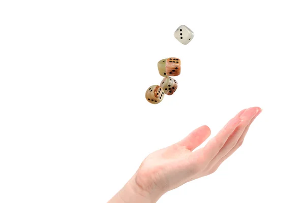 Woman throws dices isolated on white.