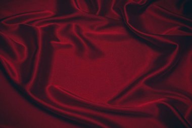 Kırmızı ipek ya da saten lüks kumaş dokusu soyut bir arka plan olarak kullanılabilir. Üst görünüm