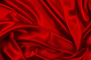 Kırmızı ipek ya da saten lüks kumaş dokusu soyut bir arka plan olarak kullanılabilir. Üst görünüm.