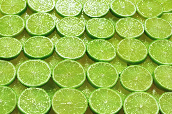 Fresh lime slices as a background.