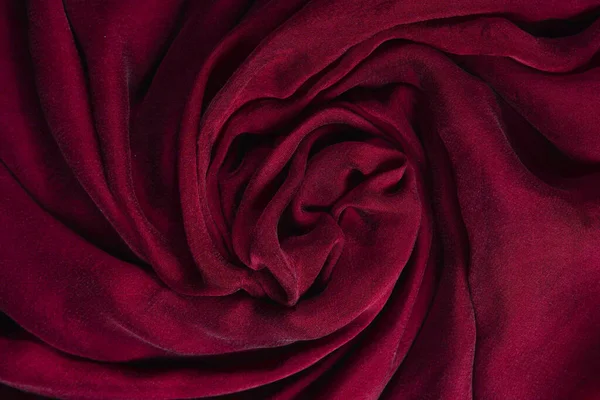 stock image Soft smooth burgundy silk fabric background. Fabric texture. 