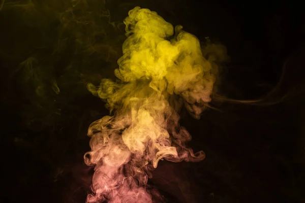 stock image Yellow and pink steam on a black background. Copy space.