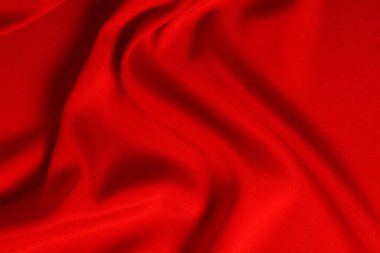 Kırmızı ipek ya da saten lüks kumaş dokusu soyut bir arka plan olarak kullanılabilir. Üst görünüm.