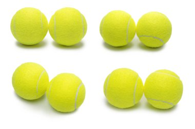 Beyaz arkaplanda izole edilmiş tenis topları. 