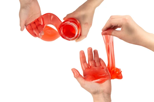 红色黏液玩具在女人手里 与白色隔离 顶部视图 — 图库照片
