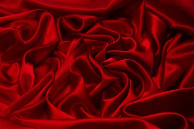 Zengin ve lüks kırmızı ipek kumaş dokusu. Üst görünüm.