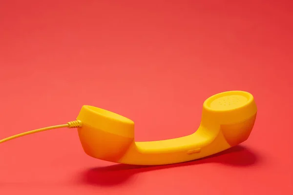 Yellow Handset Red Background — Stock Photo, Image