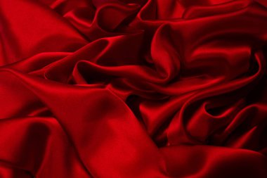 Zengin ve lüks kırmızı ipek kumaş dokusu. Üst görünüm.